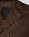 Peak lapel collar detail in dark brown suede