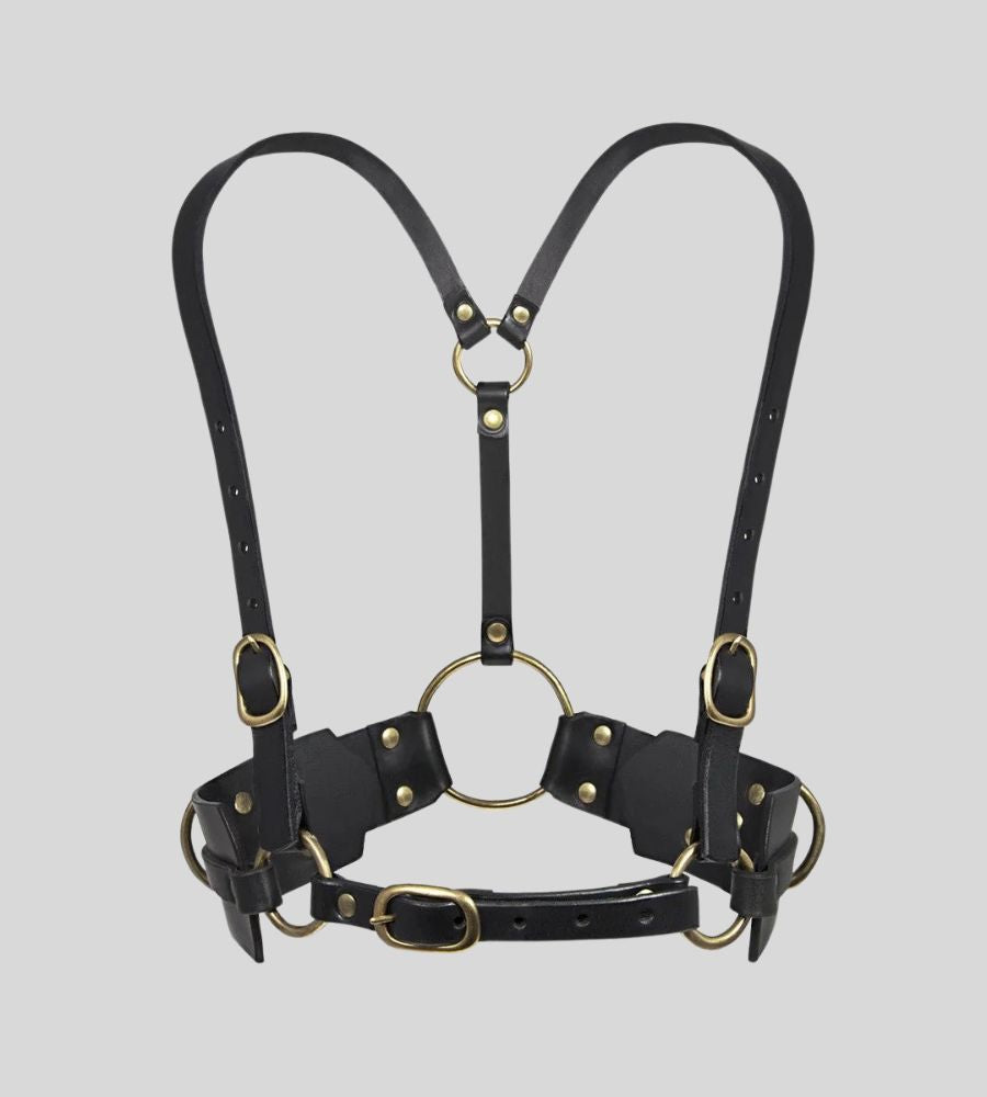 front view of black leather body harness with gold O-rings