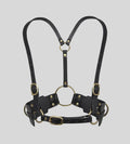 front view of black leather body harness with gold O-rings