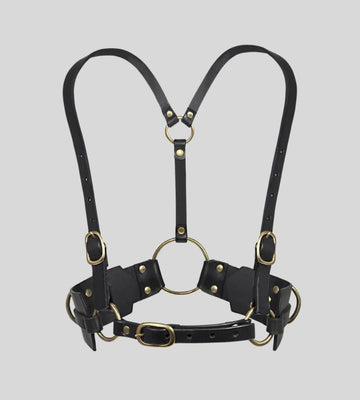 front view of black leather body harness with gold O-rings