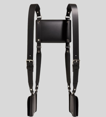flat lay of leather shoulder harness holster with triple pouch