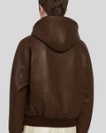 Zoomed back of leather bomber jacket showing hood seam