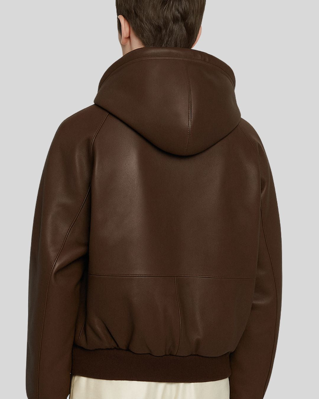 Zoomed back of leather bomber jacket showing hood seam