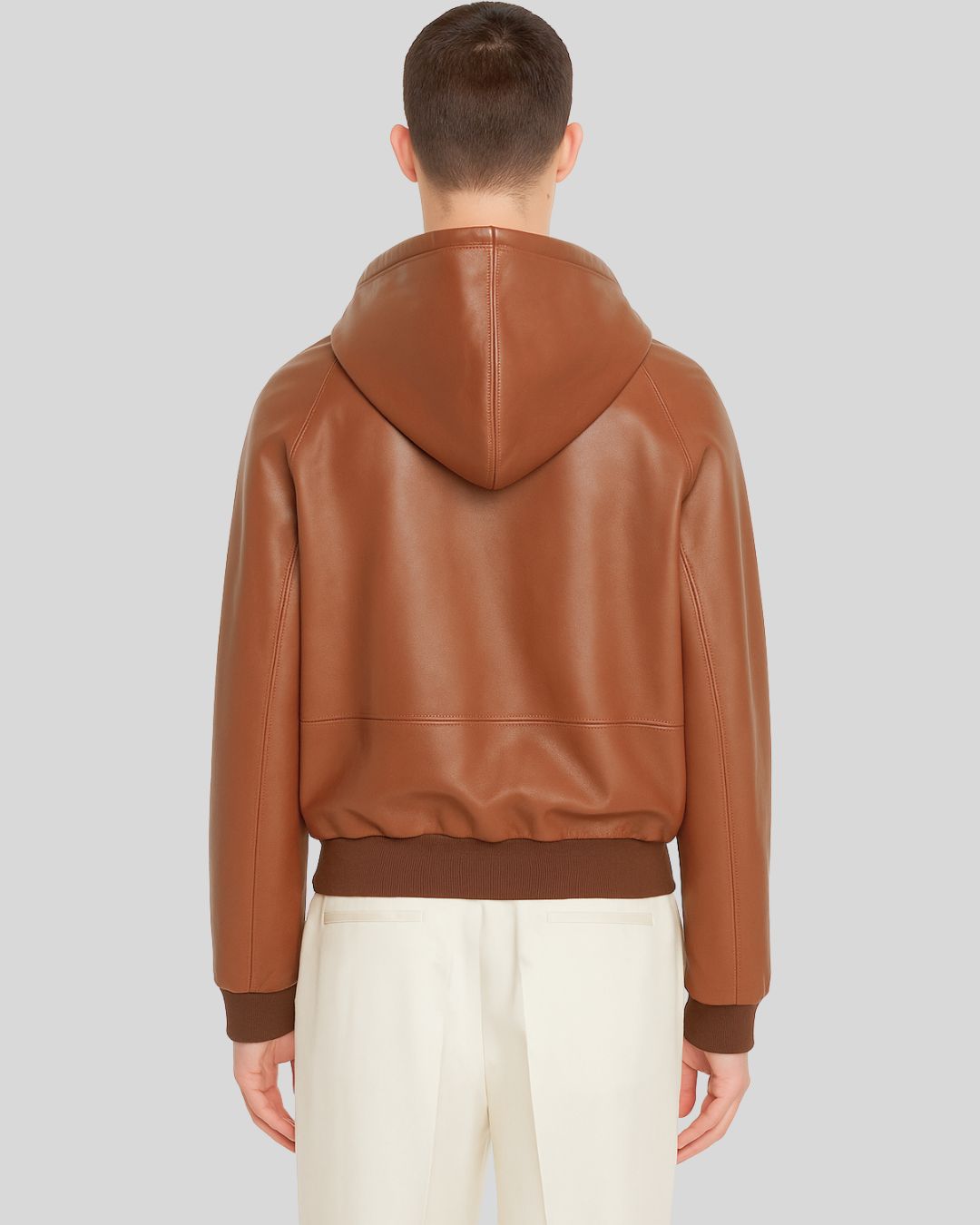 Front view of brown leather bomber jacket with hood for men