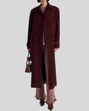  Model styling burgundy suede trench with burgundy flared pants
