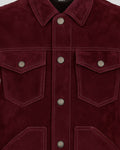 Close-up of a burgundy suede jacket with button details
