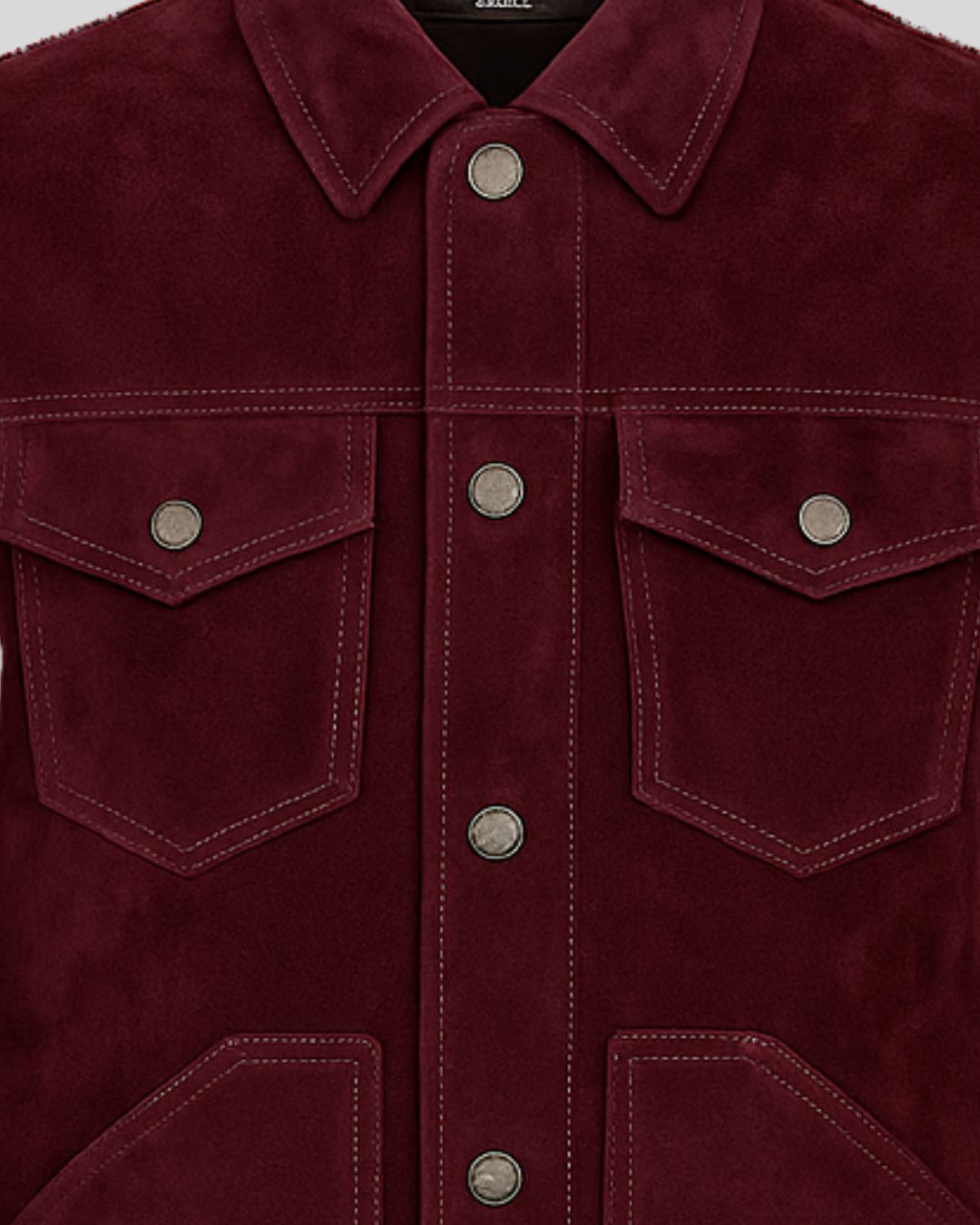 Close-up of a burgundy suede jacket with button details