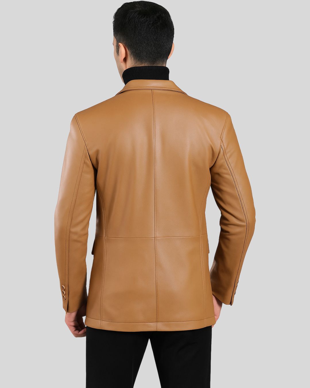 Front view of men's tan leather blazer with tailored fit and notched lapel