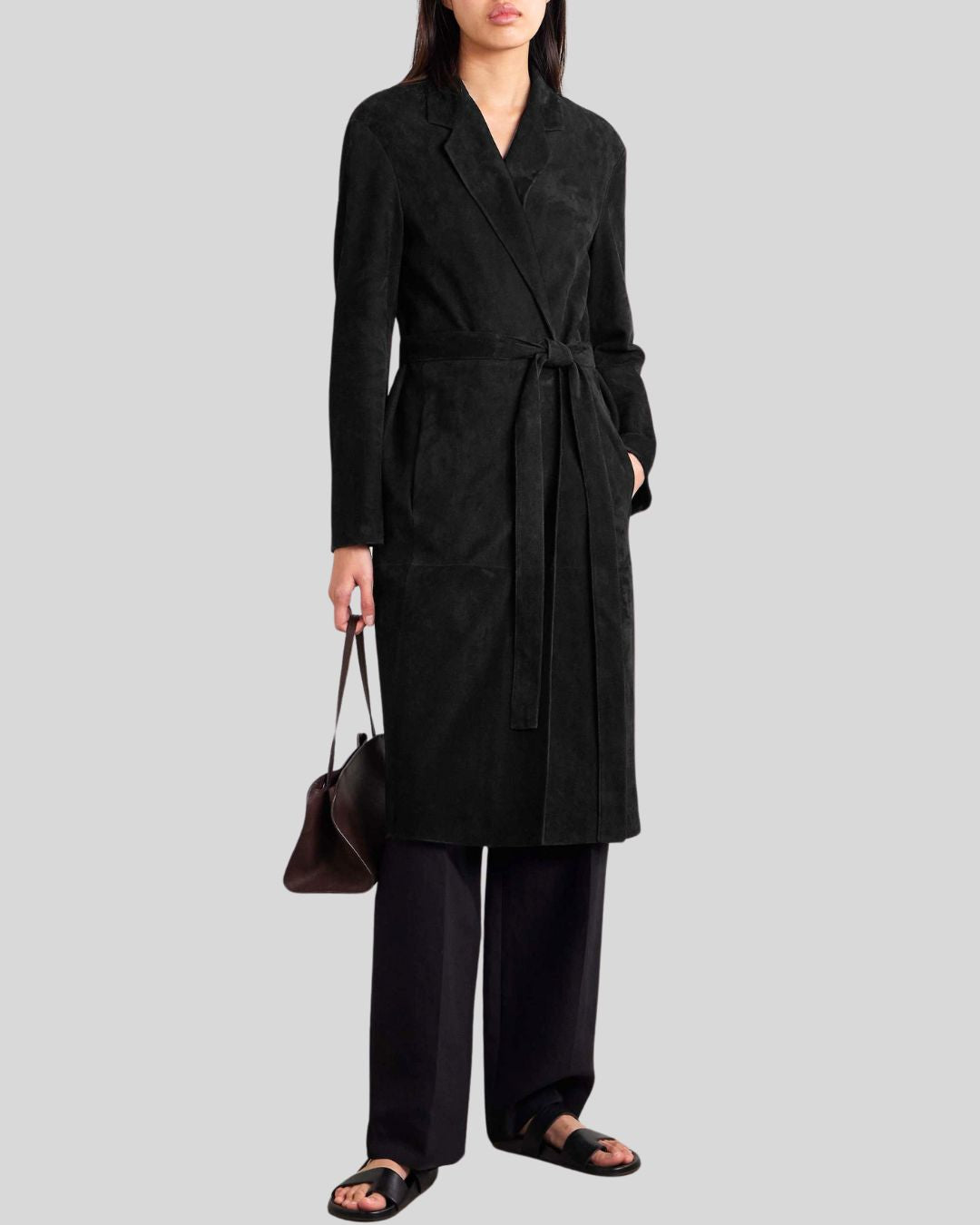  model wearing black suede trench coat with soft tie belt
