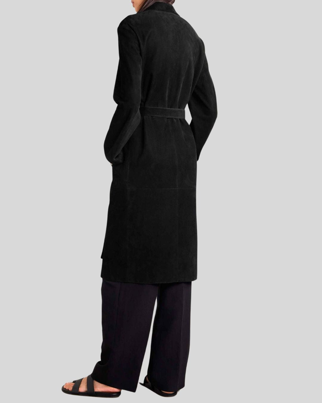  back view of long black suede trench coat with tie belt
