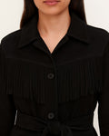  Close-up of black suede jacket showing front buttons and fringe detail
