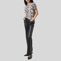 front view of black studded leather pants for women