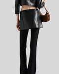 rear view of black leather micro mini skirt