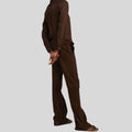  side view of dark brown suede relaxed pants