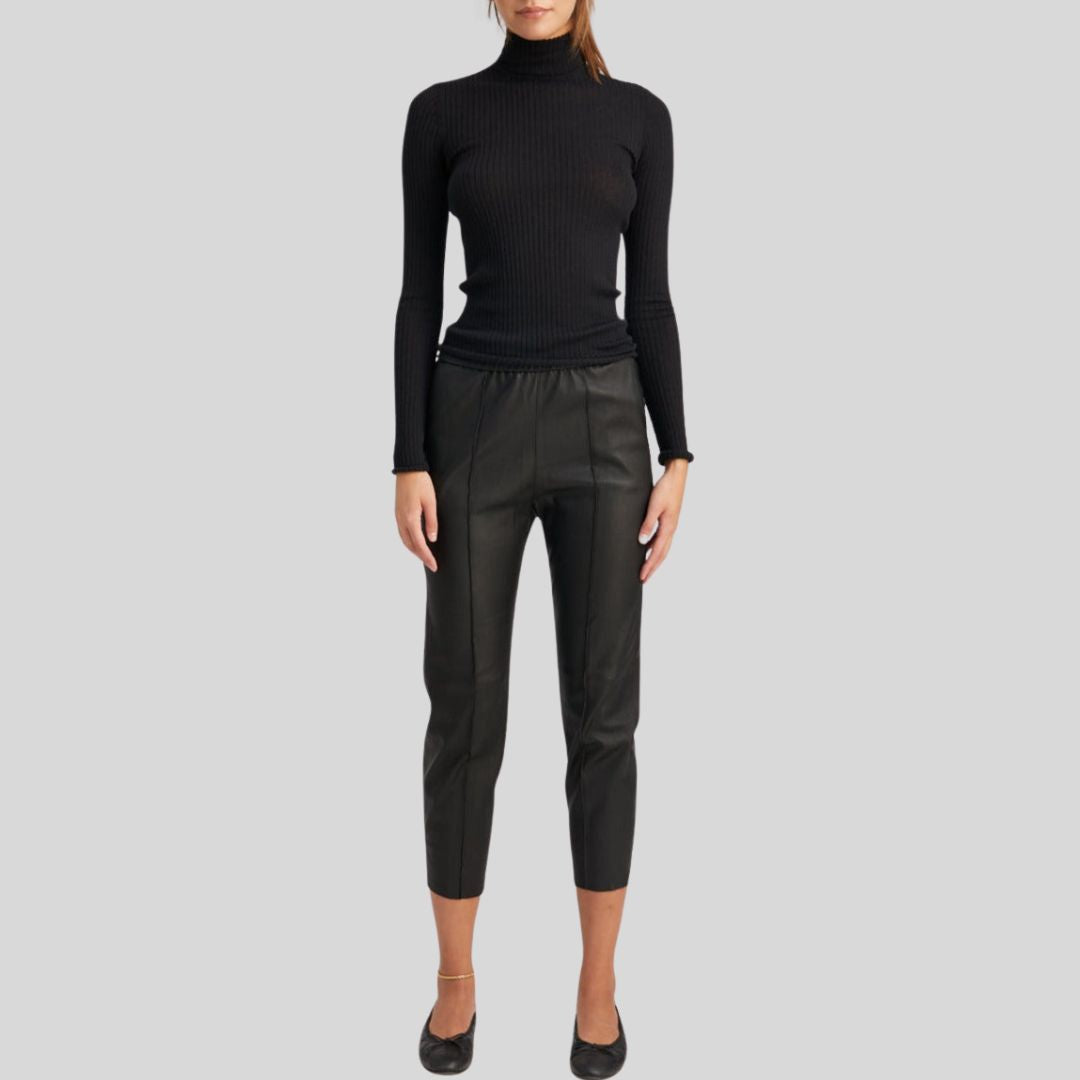 close-up of satin lined black leather cropped pants