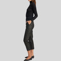 side view of tapered black cropped leather pants