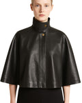 Front view of black suede poncho capelet worn by woman