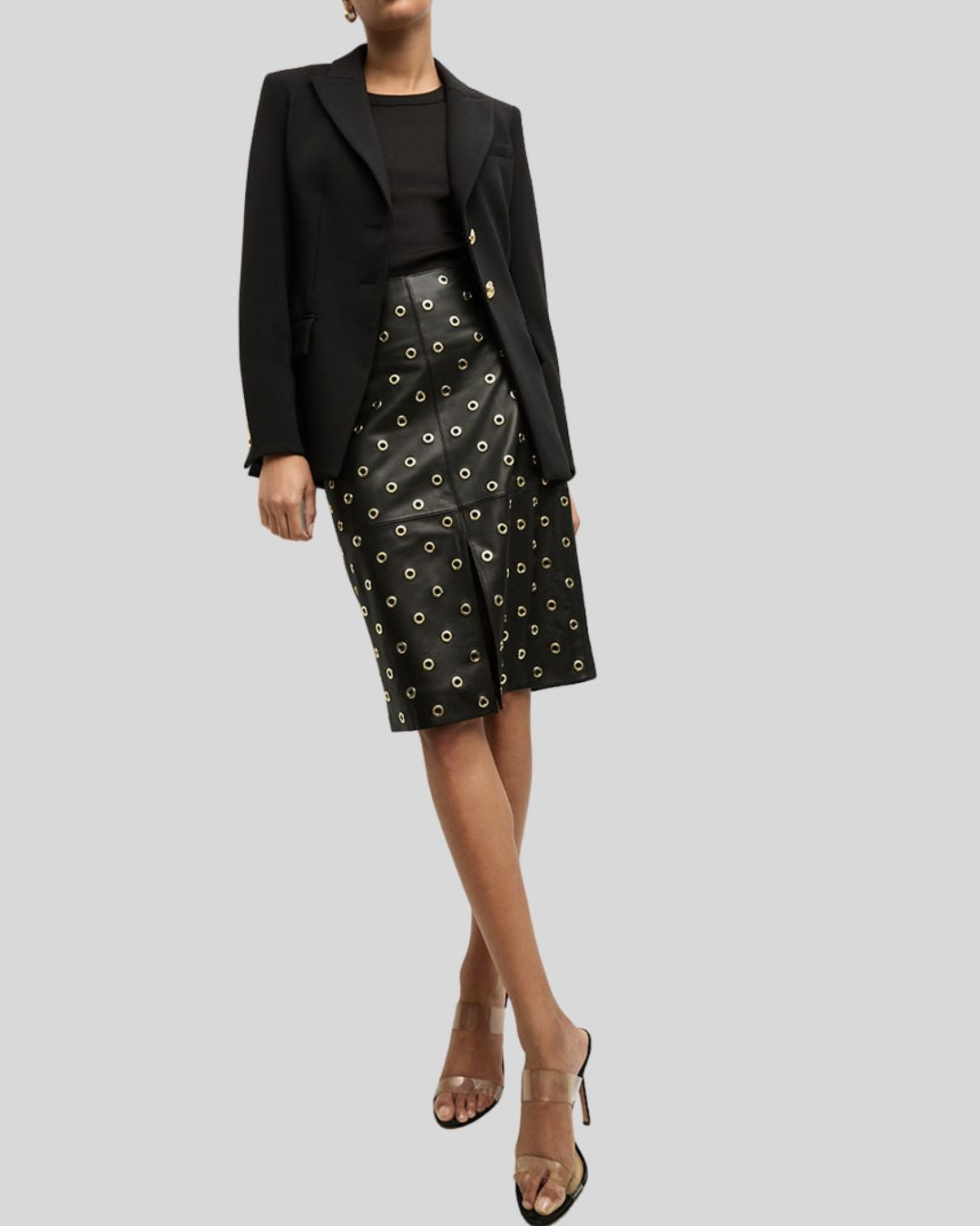 Model in Noir Edge black leather pencil skirt styled with black blazer	
