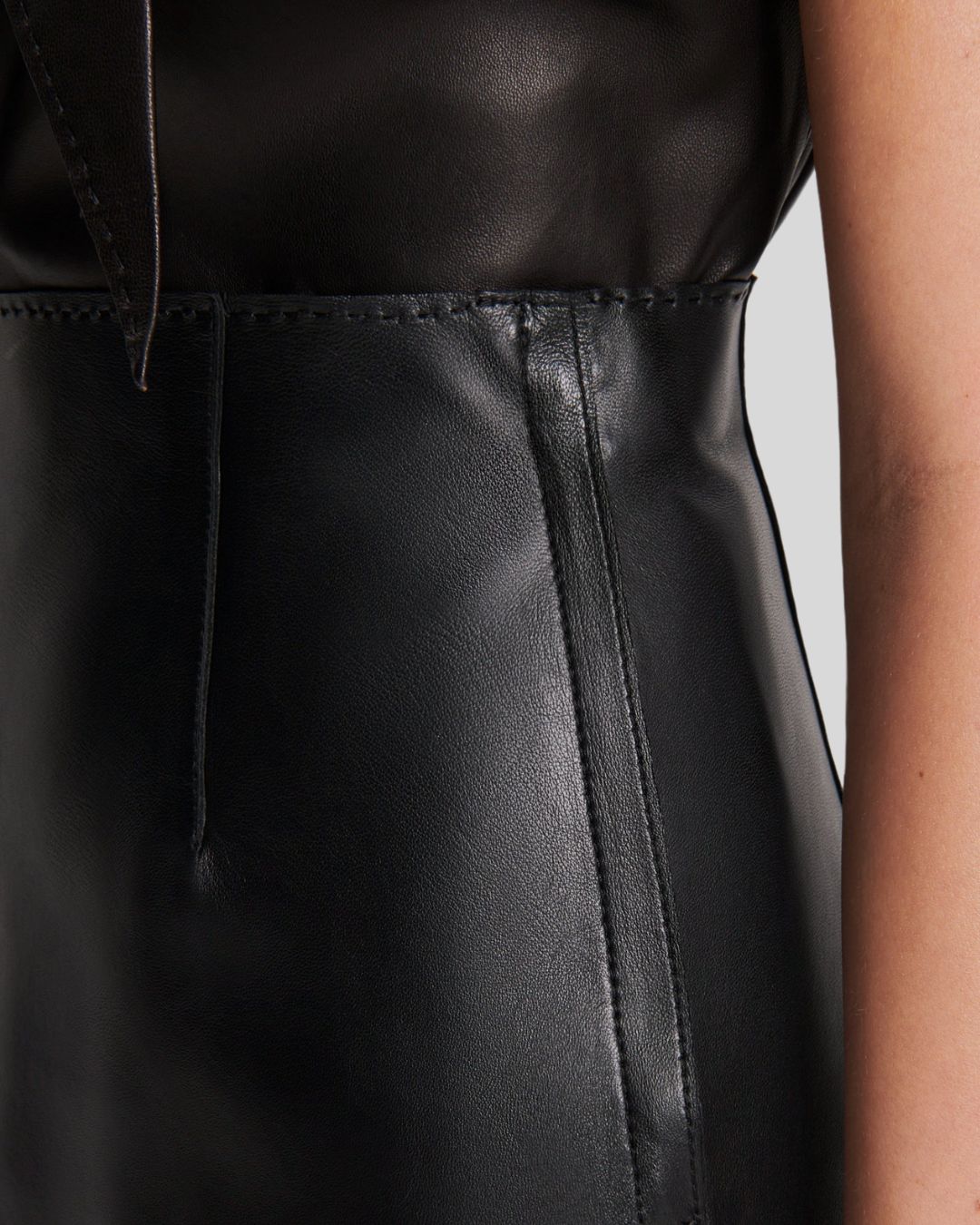 Black Leather Mini Skirt Waistband Stitching Close-Up
