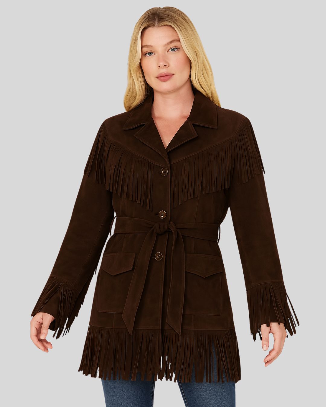 Woman wearing brown suede fringe belted jacket with front buttons and tie belt
