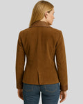  Back view of woman in tailored brown leather blazer
