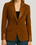  Woman in brown leather blazer with crocodile lapel
