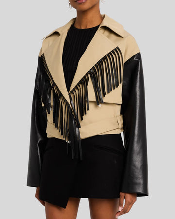 Side pose of woman wearing red suede fringe jacket with long sleeves
