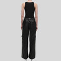back view of womens black baggy leather pants