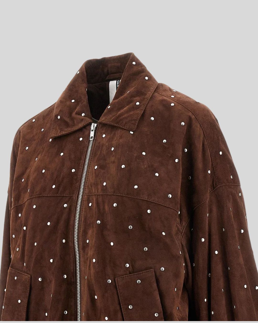 Close-up of silver-studded brown suede bomber jacket front view