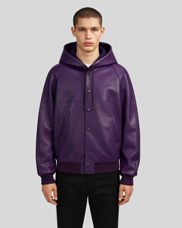 Model wearing a purple leather bomber jacket with hood, front view