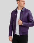 Man wearing purple bomber jacket with partially unzipped front