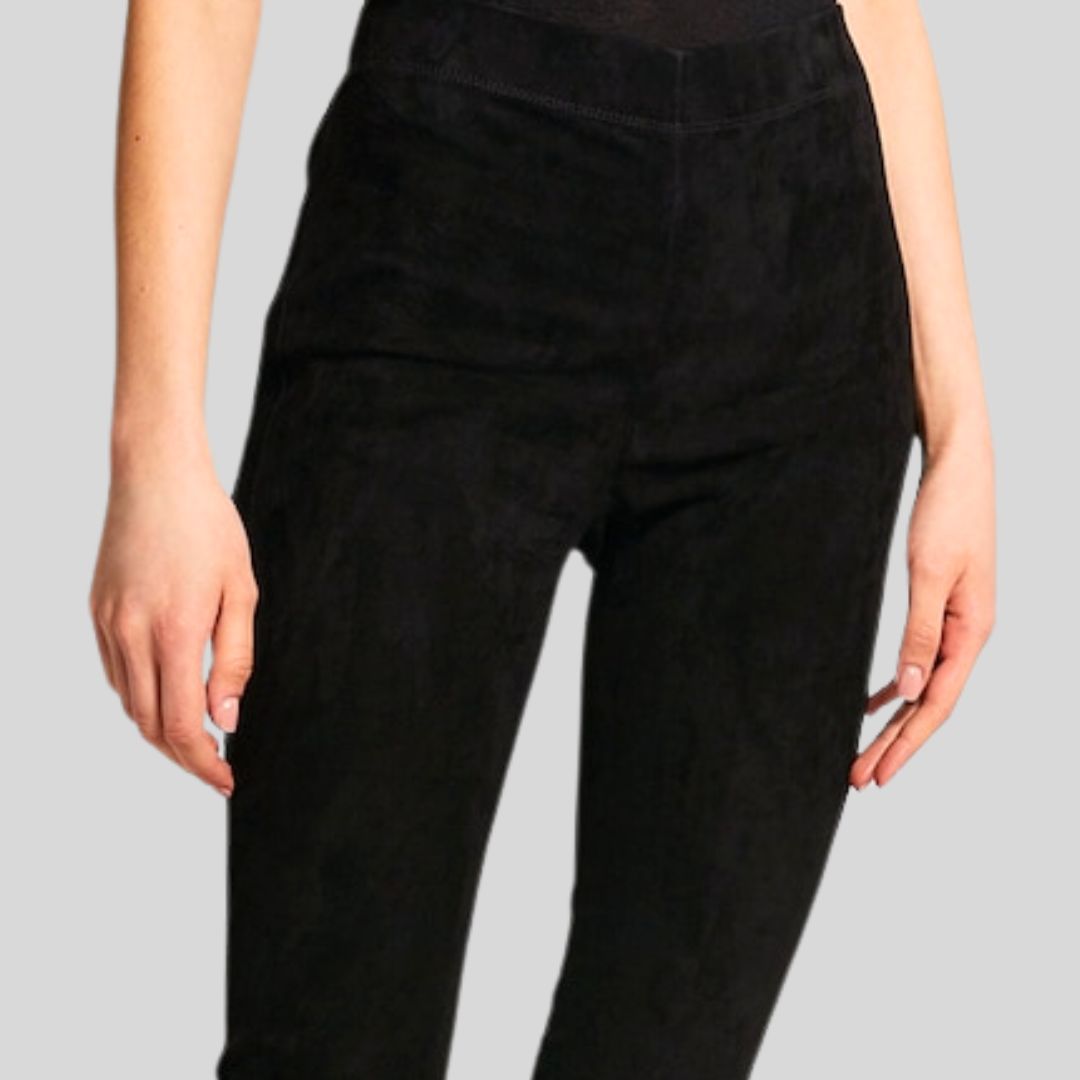 close-up of waistband and fit of black suede pants