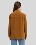  Back view of camel suede field jacket on woman with long hair