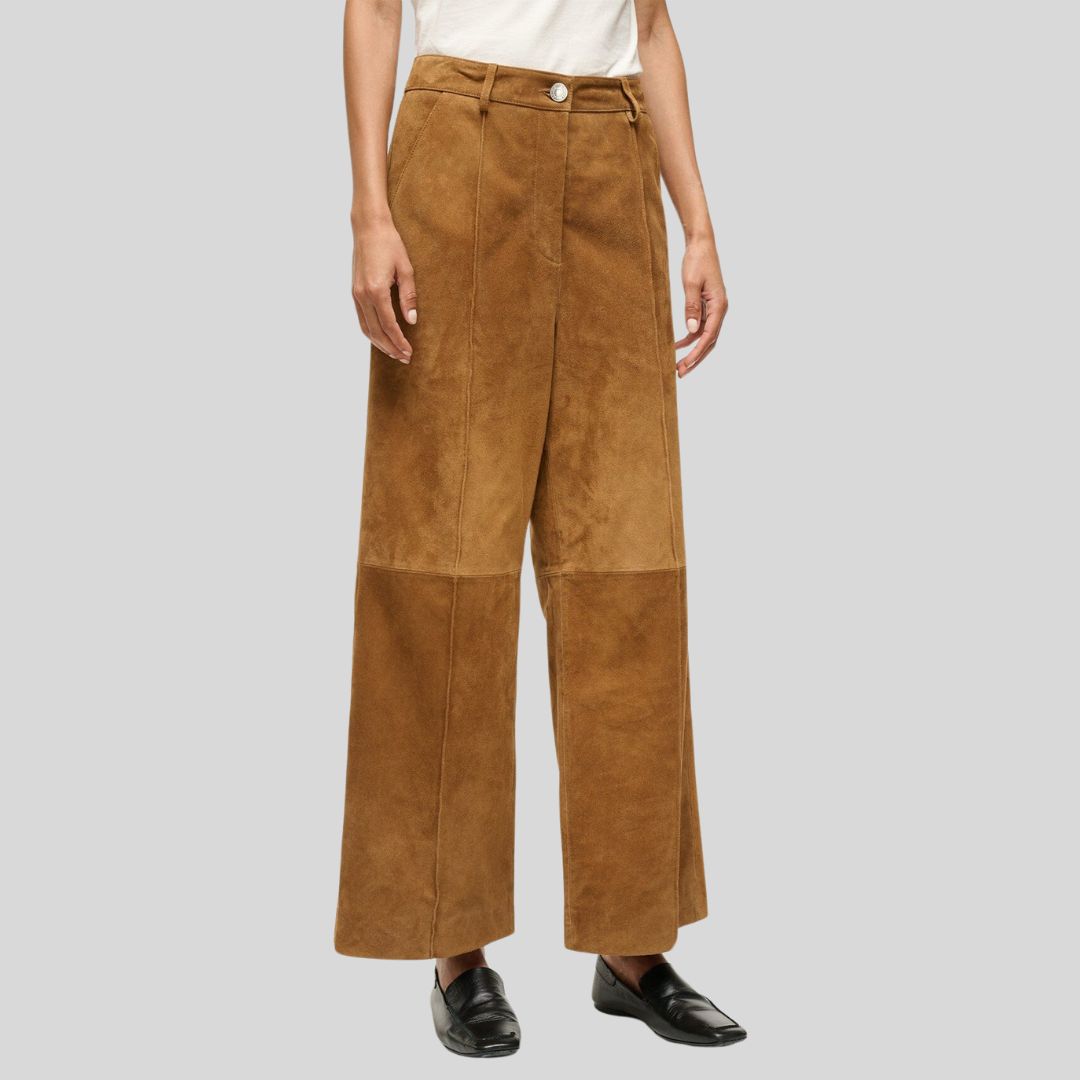 side viwe of tan suede wide leg pants with button closure