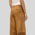 close rear view of tan suede wide leg pants with belt loops