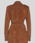  Close-up of Sahara Reign trench coat back waist with suede belt and yoke seam.
