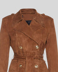 Close-up of double-breasted buttons and notched lapel on Sahara Reign brown suede trench coat.
