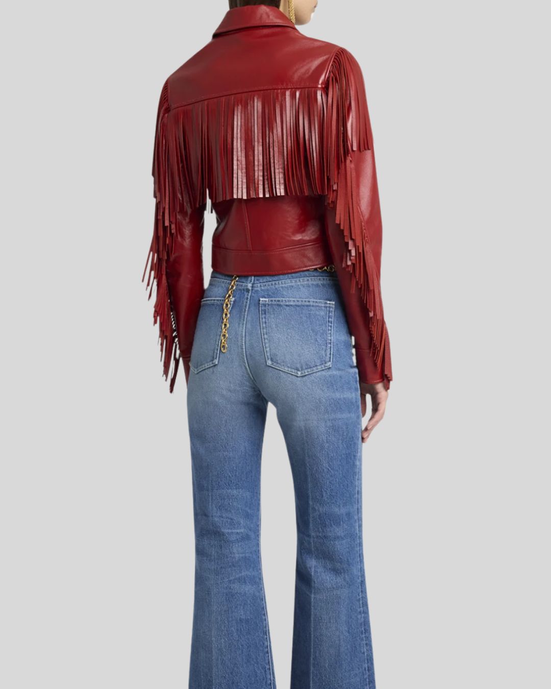  Back view of red fringe leather jacket with shoulder and sleeve detailing
