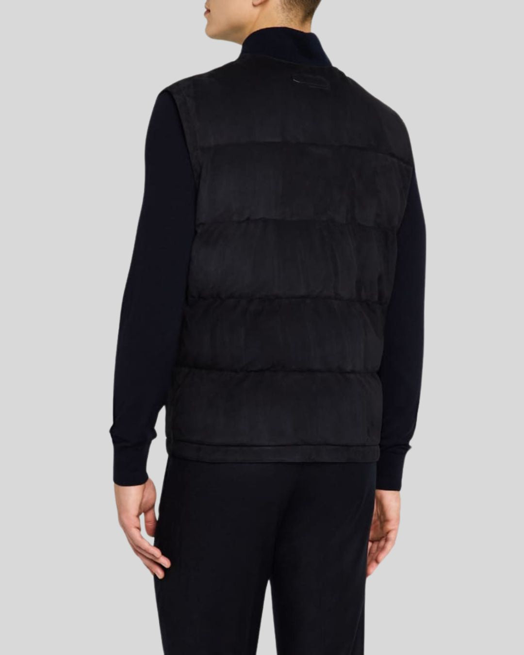 back view of black suede puffer vest