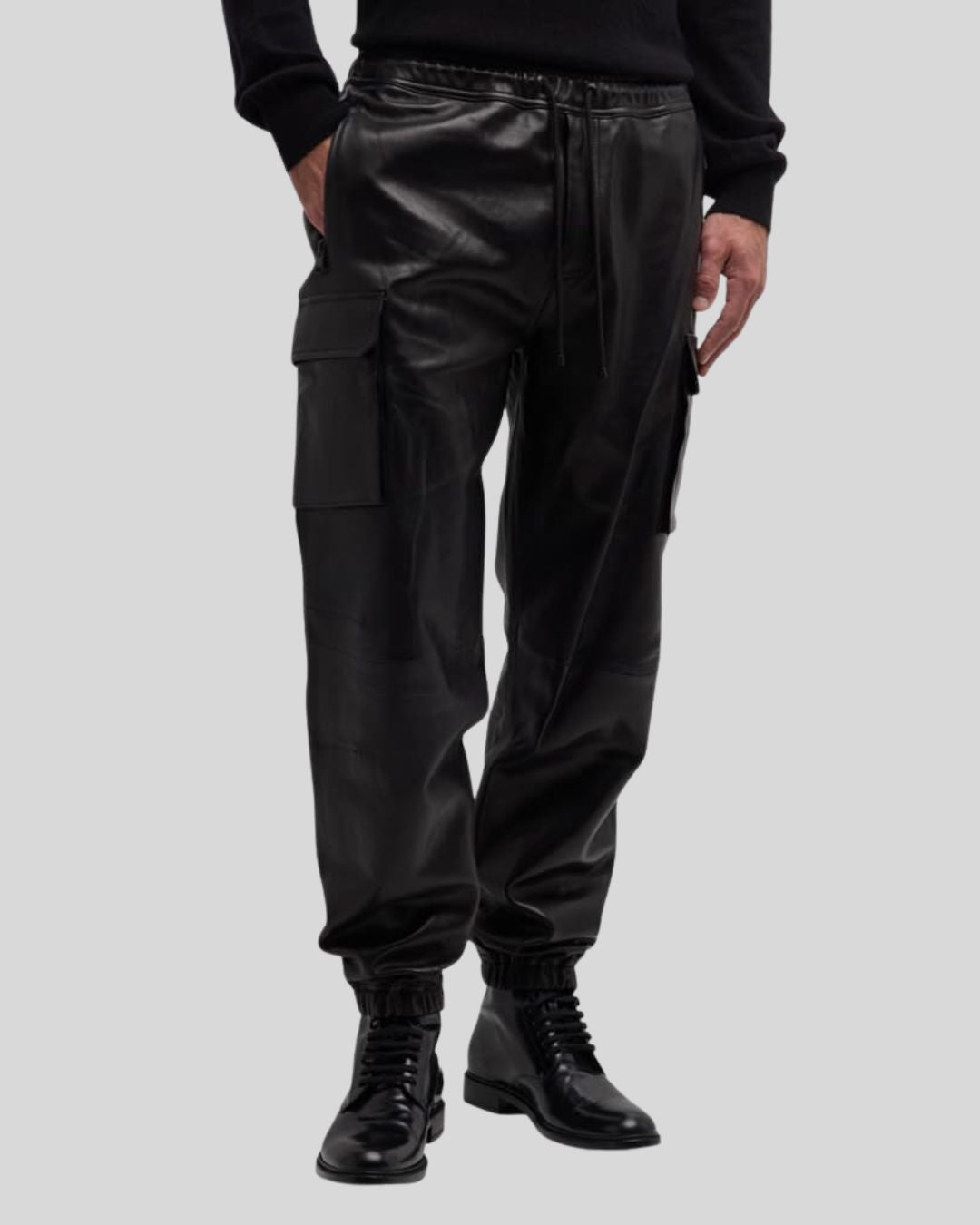 side angle view of black leather cargo pants – Blackout Jet