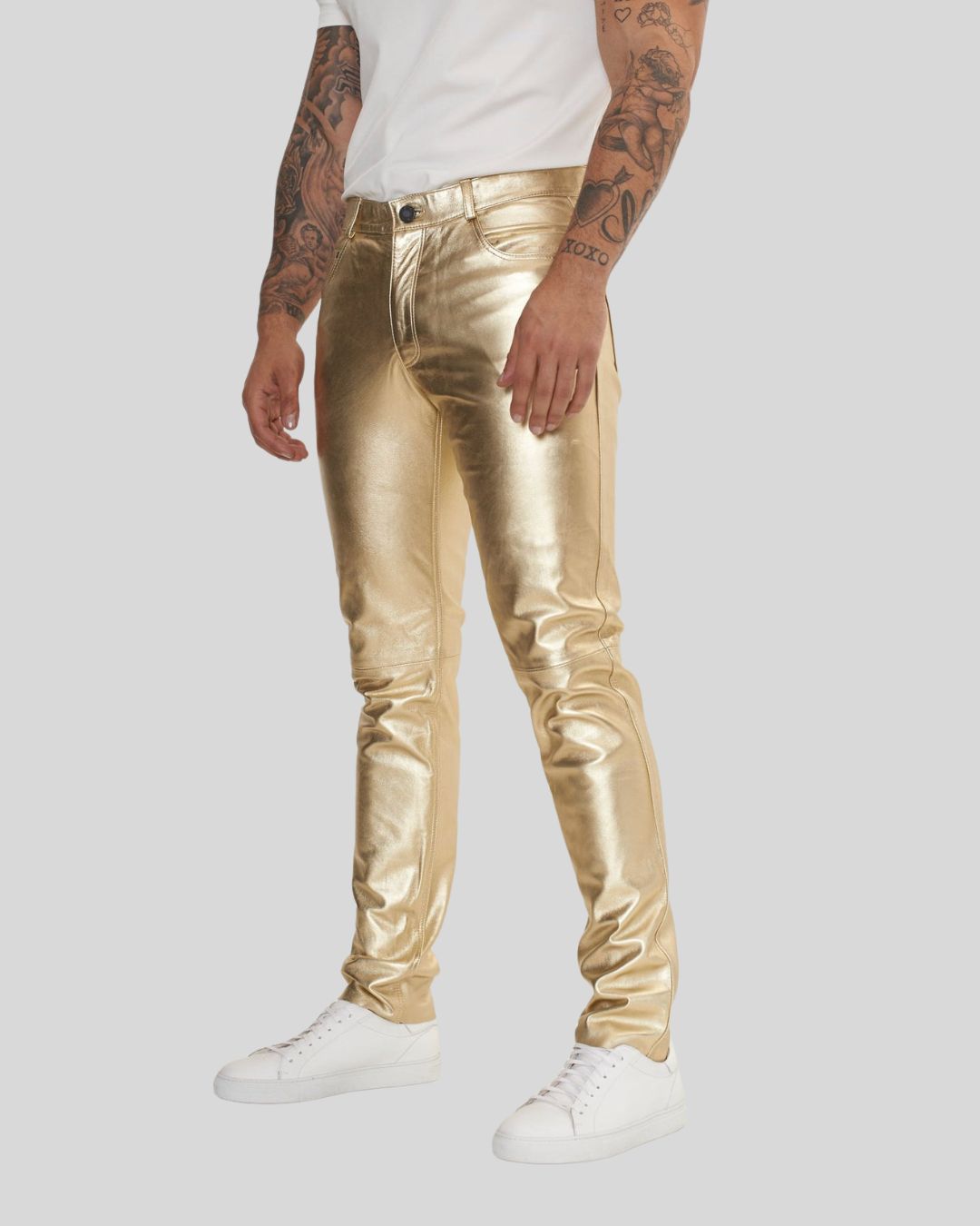 side angle of gold leather pants on man
