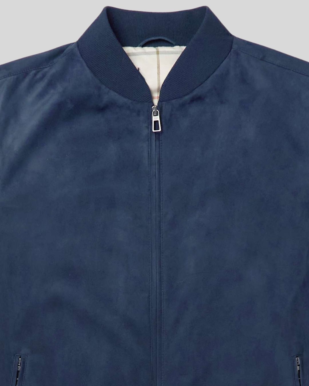 close-up of blue suede texture and bomber collar