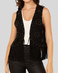  Front close-up of black suede vest with round studs in circular patterns
