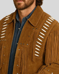 Side angle of man in tan fringe jacket showing beaded shoulder