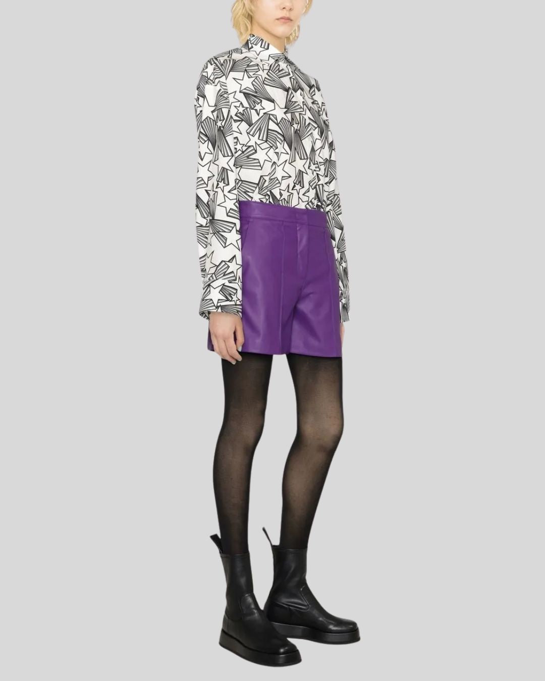 Side view of purple leather shorts women in minimalist tailored style