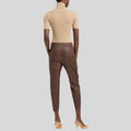 Back view of cropped brown leather pants womens