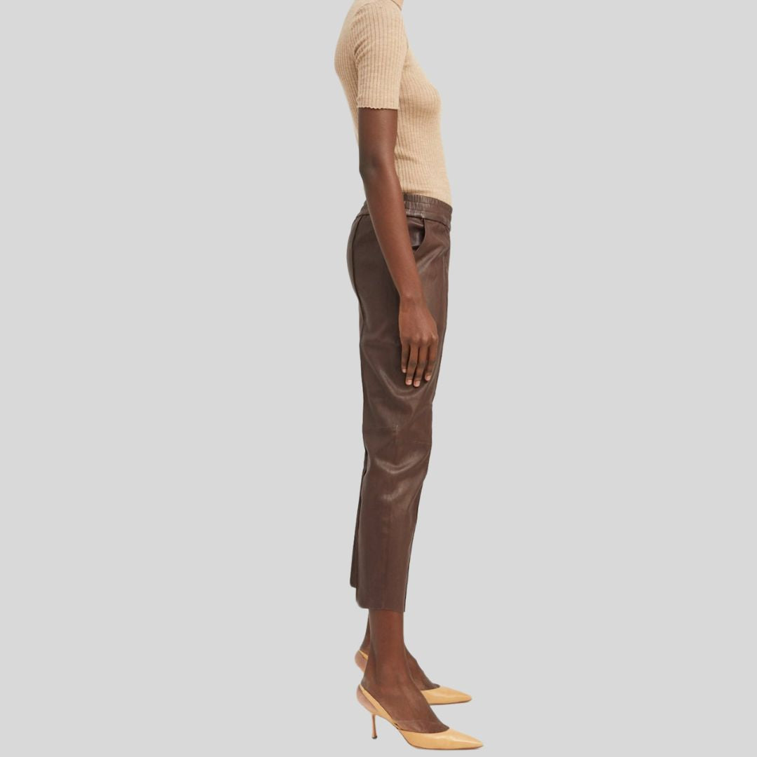 Side view of high rise brown pants in lambskin leather
