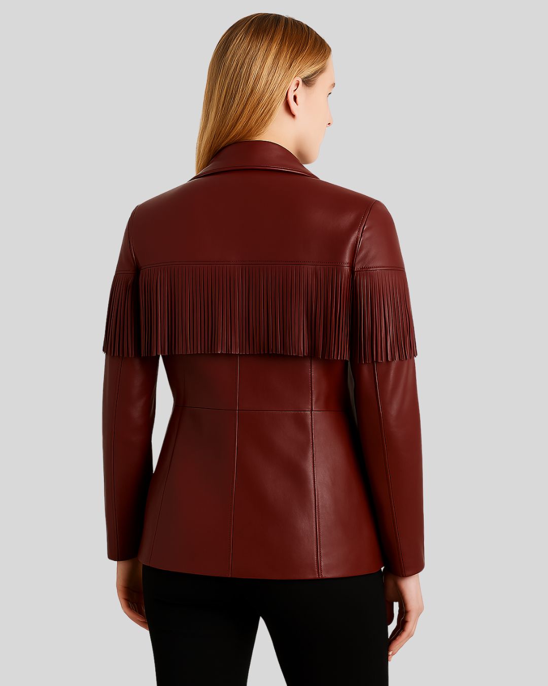  Full outfit shot of burgundy leather fringe jacket on woman
