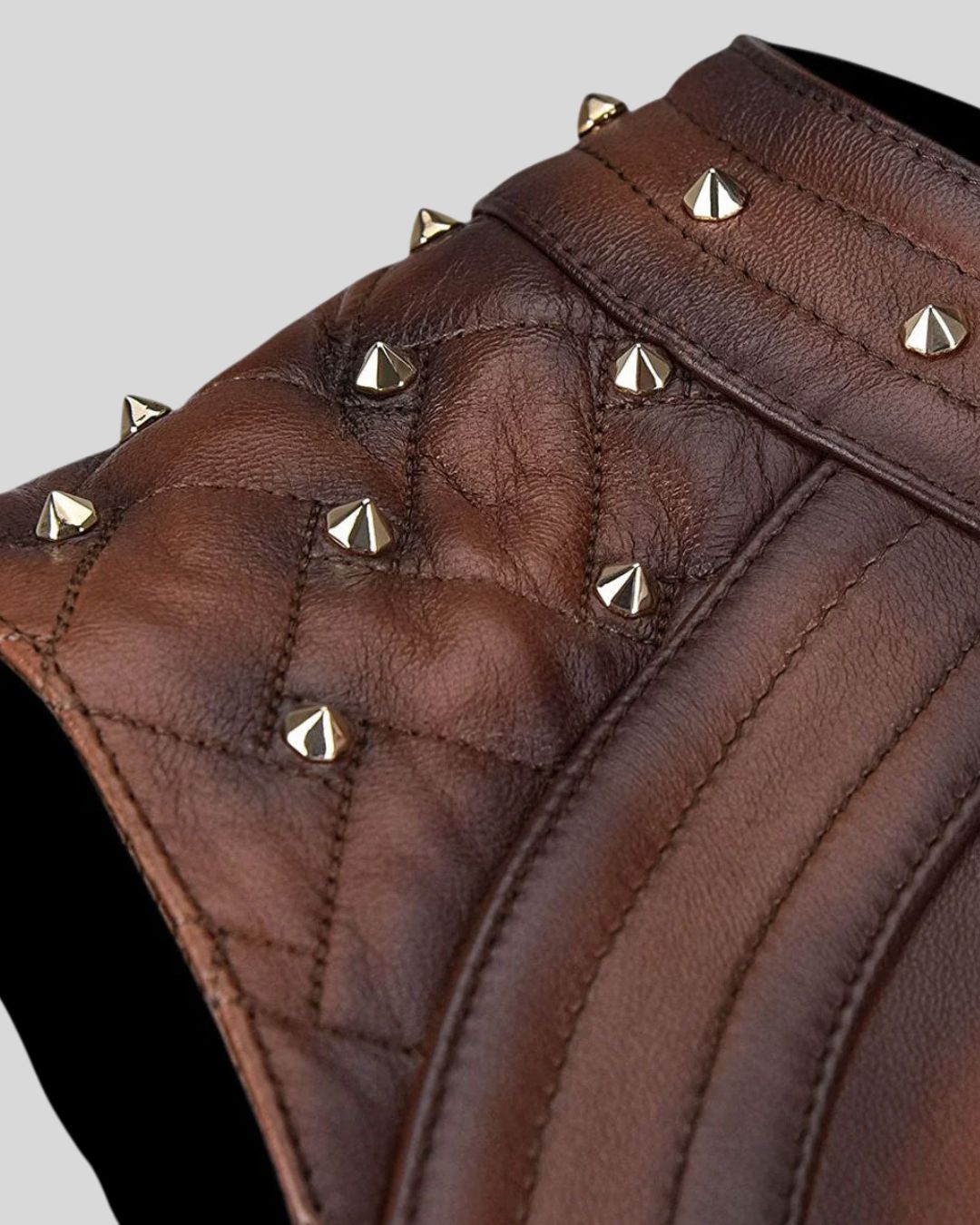 Close-up of quilted leather and studded shoulders on Sierra Edge vest
