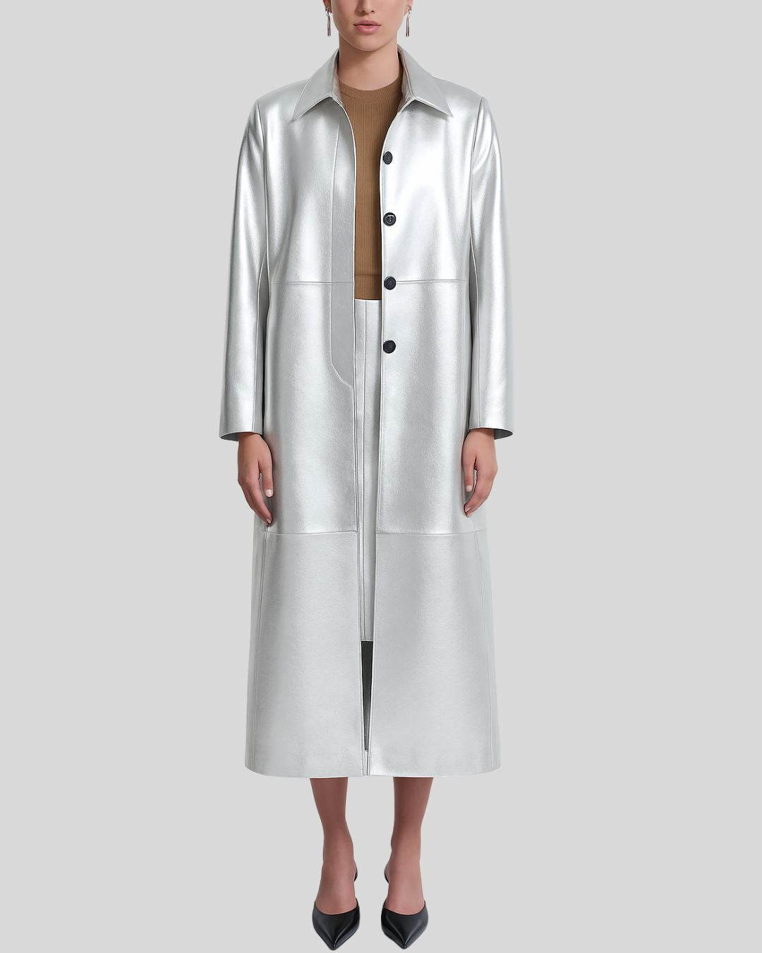 Model wearing a silver metallic leather trench coat for women, full front view